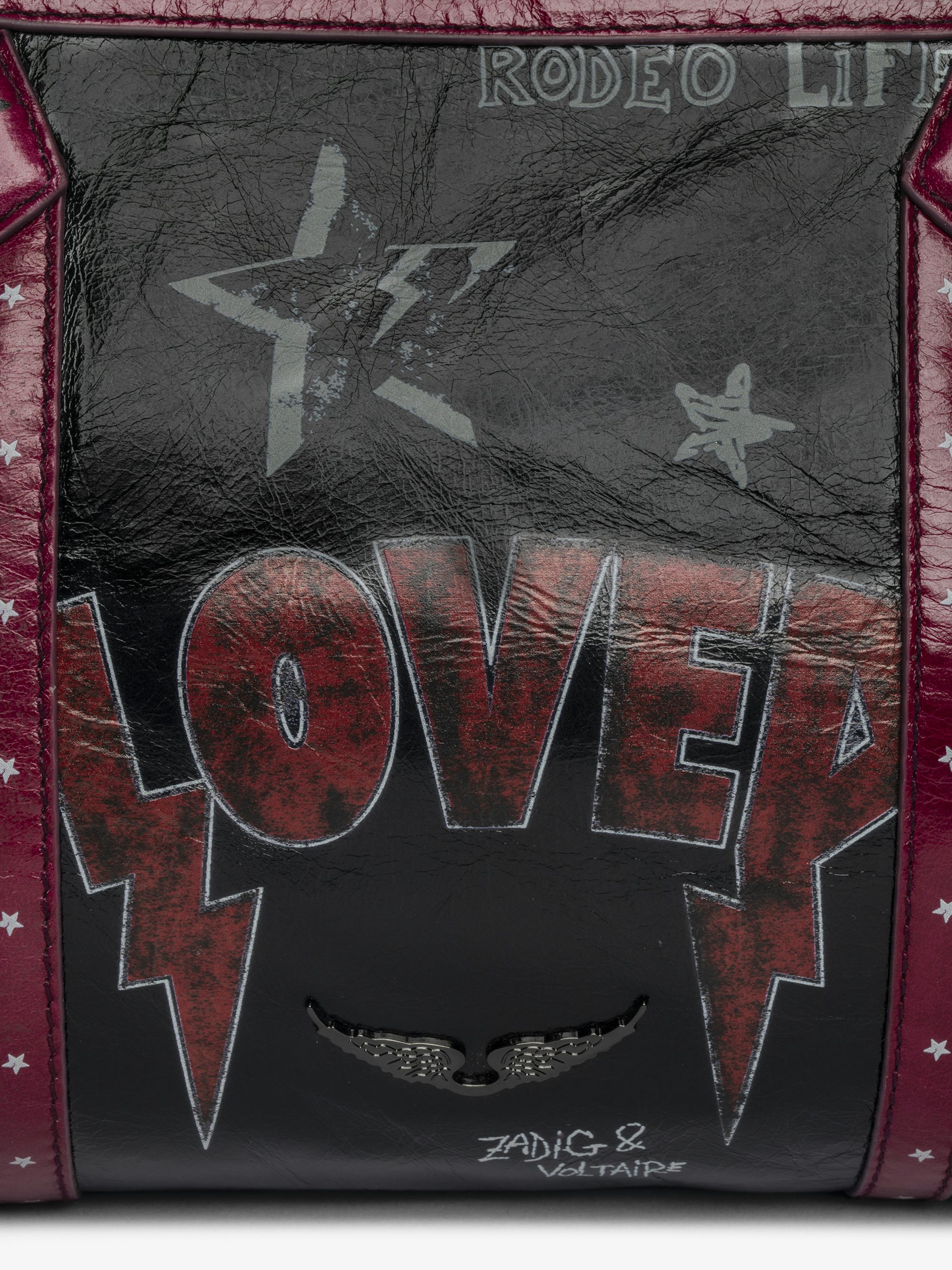 Sunny Moody Punk Bag - Vintage-inspired patent leather bag with adjustable shoulder strap and wing signature.